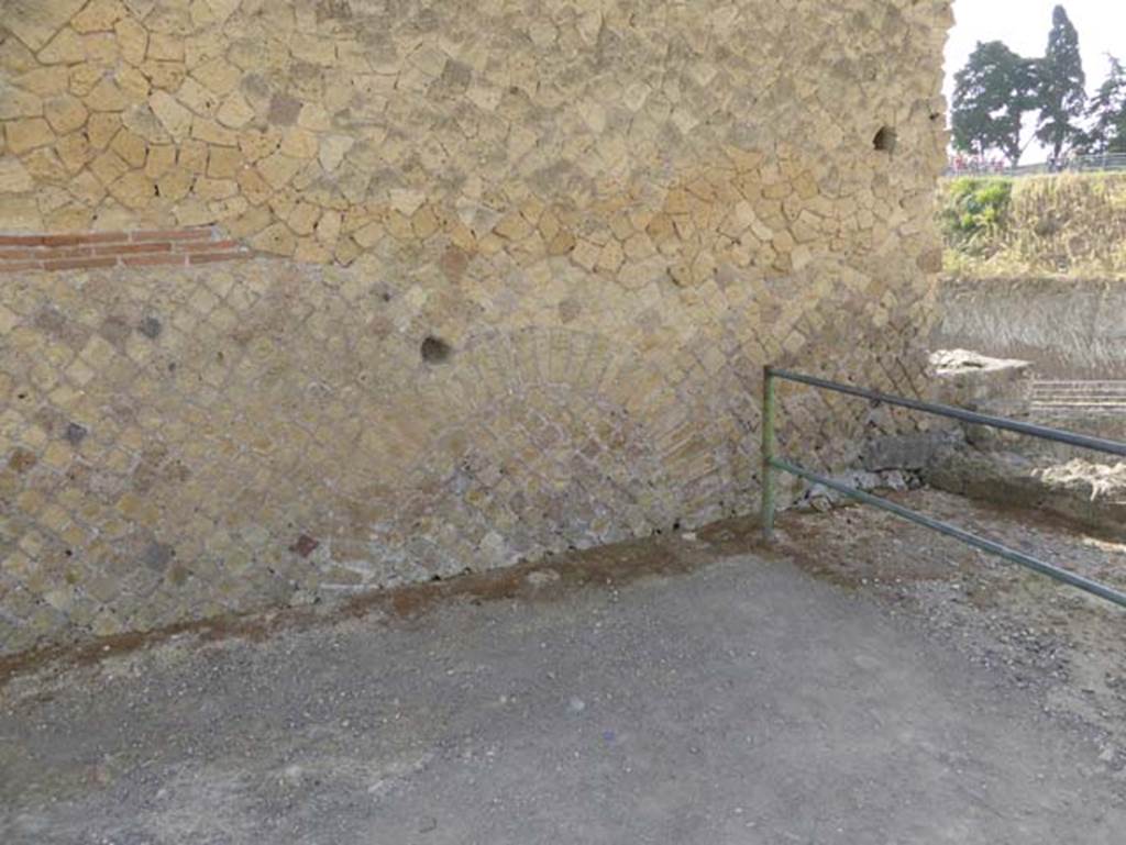 IV.2/1, Herculaneum, October 2014. Looking east across Cardo IV at its southern end, towards side wall of IV.2/1. Photo courtesy of Michael Binns.